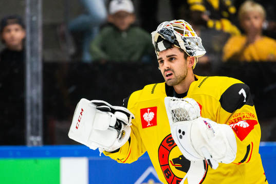 Goalkeeper Niklas Schlegel of Bern having problem with his