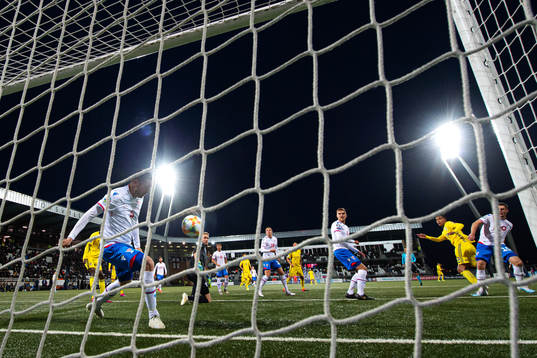 Atli Gregersen of Faroe Islands saves a shot from Robin
