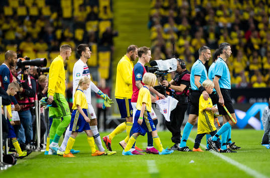The players enter the field