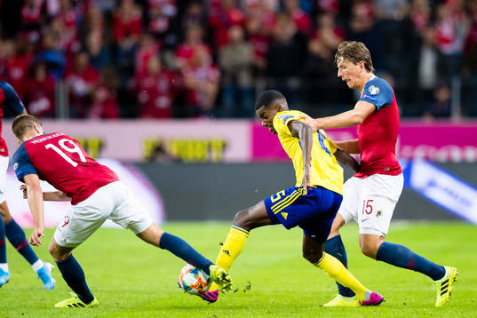 Alexander Isak of Sweden battles for the ball with Markus