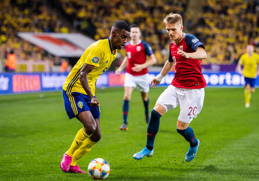 Alexander Isak of Sweden and Martin Ødegaard of Norway