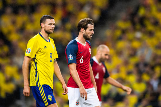 Marcus Berg of Sweden and Håvard Nordtveit of Norway look