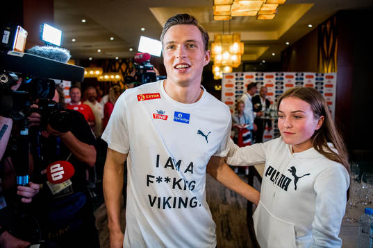 Karsten Warholm of Norway celebrates with his team