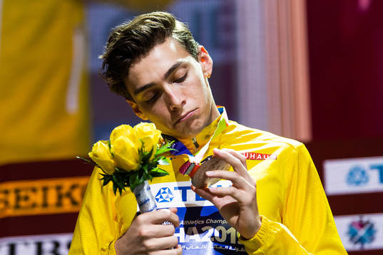 Armand Duplantis of Sweden looks at his silver medal at the