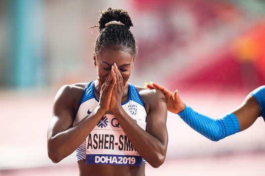 Dina Asher-Smith of Great britain celebrates winning