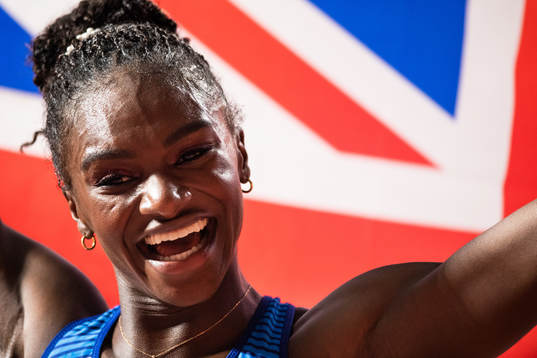 Dina Asher-Smith of Great britain celebrates winning