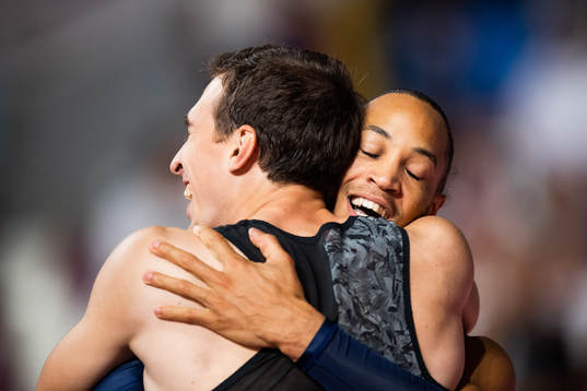 Sergey Shubenkov of Russia hugs bronze medalist Pascal