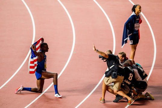 Grant Holloway of USA poses for photographers