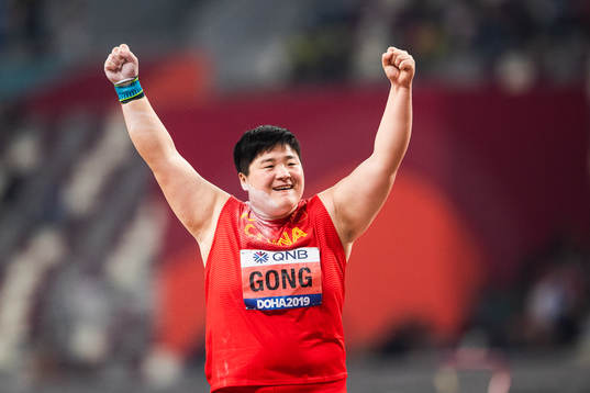 Lijao Gong of China celebrates winning the women’s shot