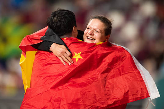 Gold medalist Lijao Gong of China celebrate with bronze