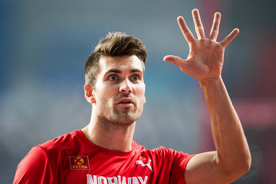 Martin Roe of Norway holds up five fingers