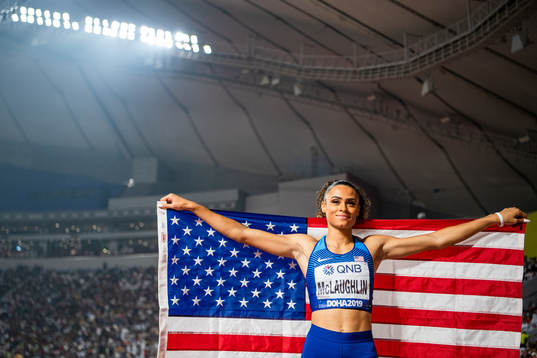 Sydney McLaughlin of USA celebrates with the American flag