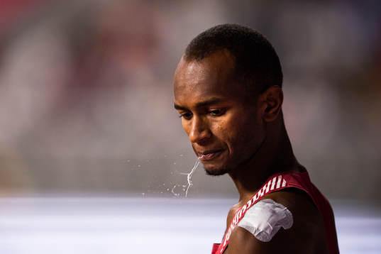Mutaz Essa Barshim of Qatar spits when competing in the