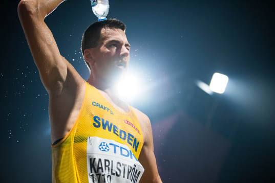 Perseus Karlström of Sweden pours water over his head as he