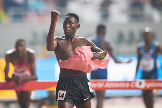 Conseslus Kipruto of Kenya celebrates winning the men’s