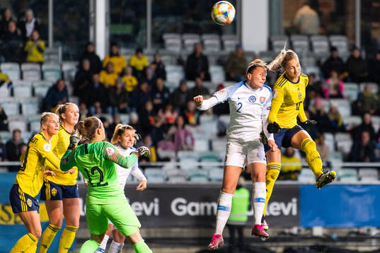 Lucie Harsanyova of Slovakia defends against Nathalie