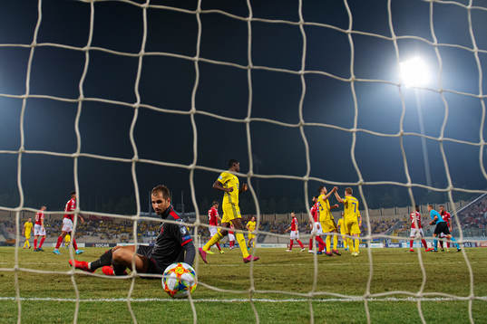 Goalkeeper Henry Bonello of Malta looks dejected