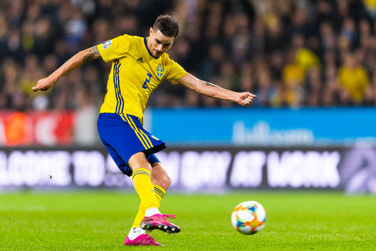 Mikael Lustig of Sweden shoots