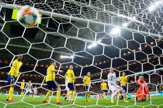 Rodrigo of Spain scores 1-1 behind goalkeeper Robin Olsen
