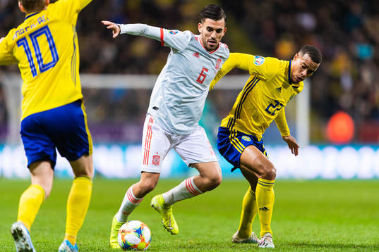 Dani Ceballo of Spain and Robin Quaison of Sweden compete