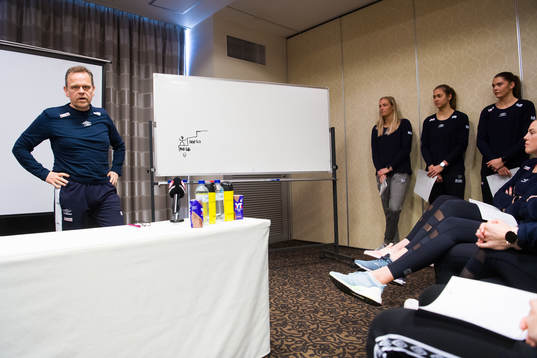 The team are listening to head coach Thorir Hergeirsson