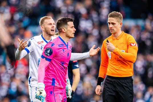 Thore Baardsen Pedersen and Goalkeeper Helge Sandvik of