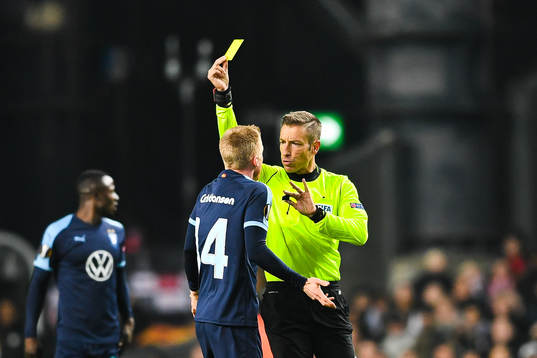 Anders Christiansen of Malmö FF receives a yellow card
