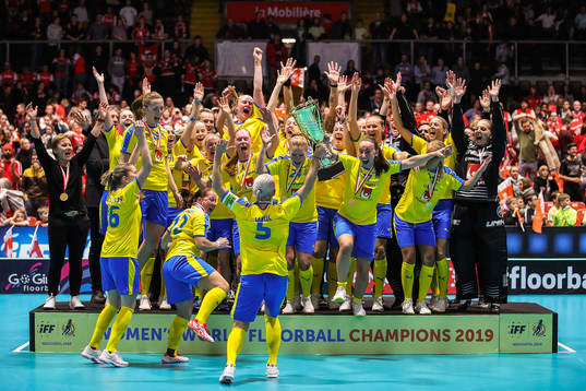 Players of Sweden celebrate with the trophy