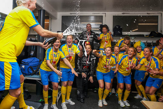 Players of Sweden celebrate in the locker room