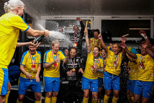 Anna Wijk of Sweden celebrate with teammates in the locker