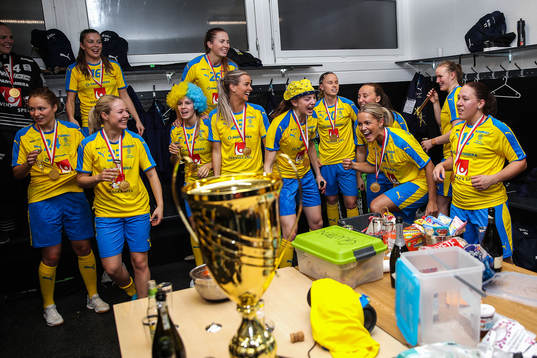 Players of Sweden celebrate in the locker room