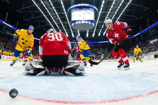 Nils Höglander of Sweden scores the 0-3 goal behind