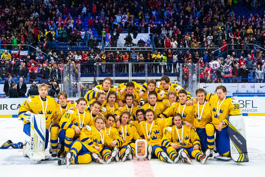 Players of Sweden celebrate with the trophy