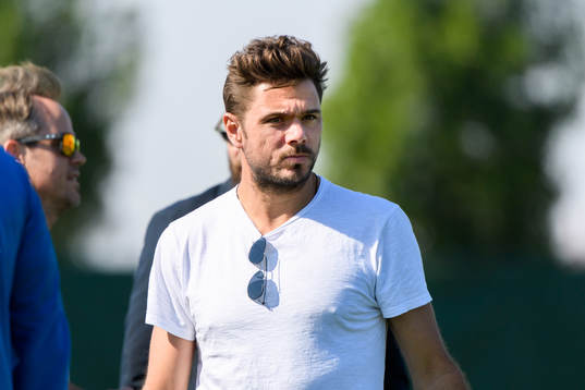 Tennis player Stanislas Wawrinka watches a training session