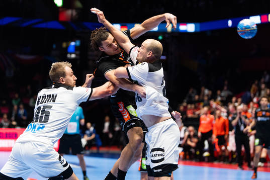 Julius Kühn and Paul Drux of Germany defend against Iso