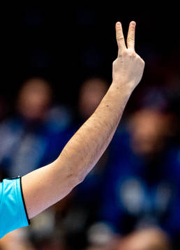 The referee gives a player a two-minute suspension