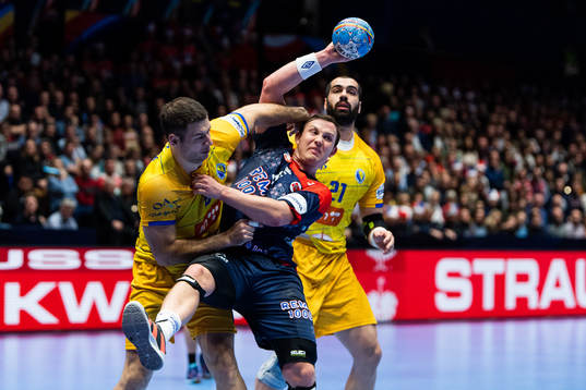 Marko Panić of Bosnia and Herzegovina defends against