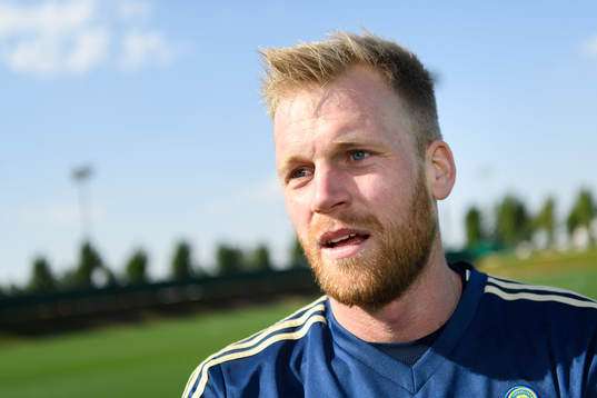 Goalkeeper Peter Abrahamsson is being interviewed