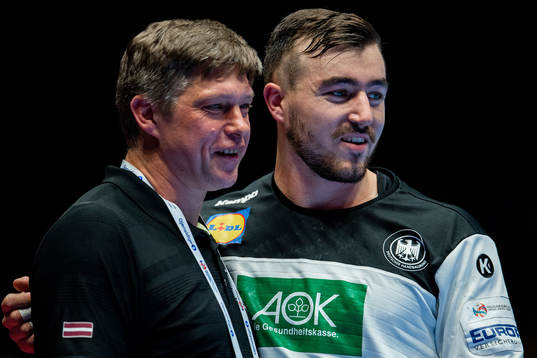 Armands Uscins, head coach of Latvia, and Jannik Kohlbacher