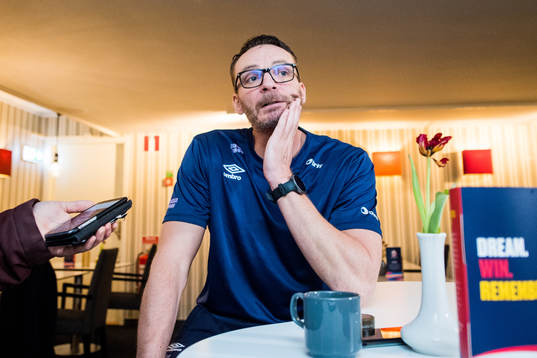 Christian Berge, head coach is interviewed by the media