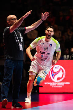 Blaz Janc of Slovenia celebrates infront of Jordi Ribera