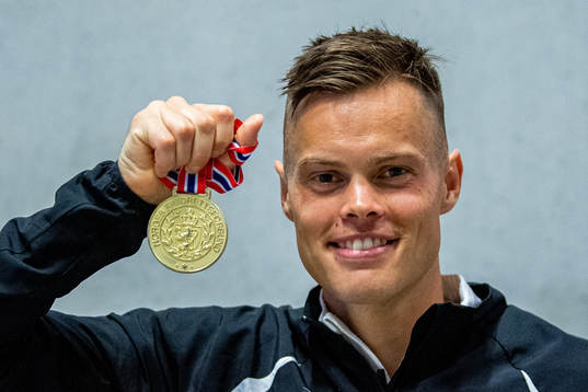 Håvard Haukenes of Norway poses with his gold medal