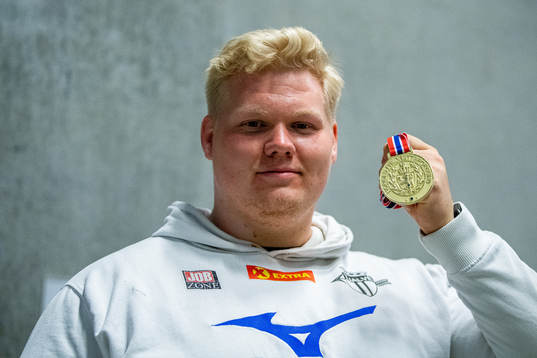 Marcus Thomsen of Norway poses with his gold medal