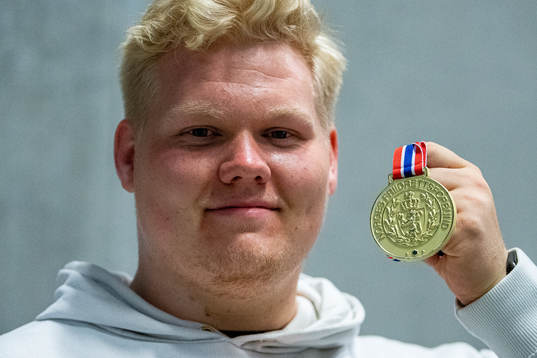 Marcus Thomsen of Norway poses with his gold medal