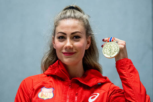 Isabelle Pedersen of Norway poses with her gold medal for
