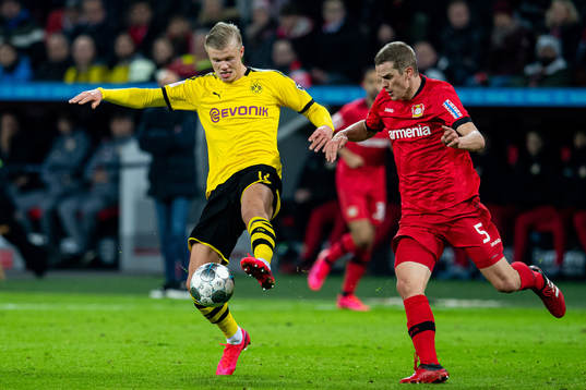 Erling Braut Haaland of Borussia Dortmund and Sven Bender