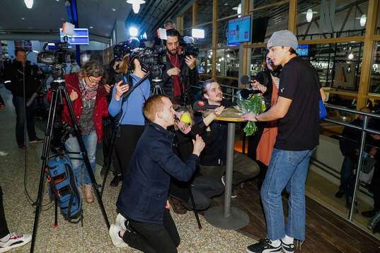 Journalists interview Armand Duplantis as he arrives at