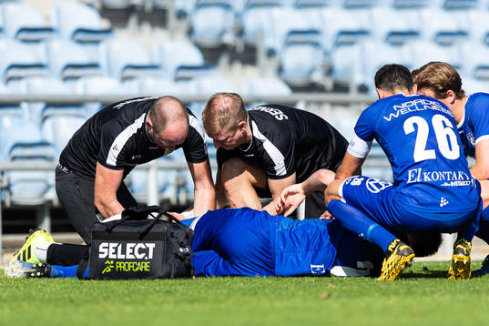 Emil Holm of IFK Göteborg is seen to by medical staff due