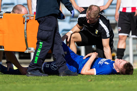 Emil Holm of IFK Göteborg is seen to by medical staff due