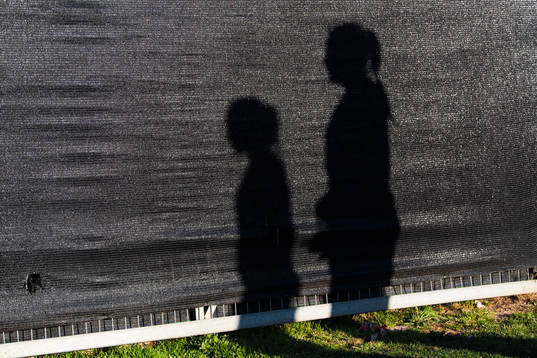 Shadows of players against a wall